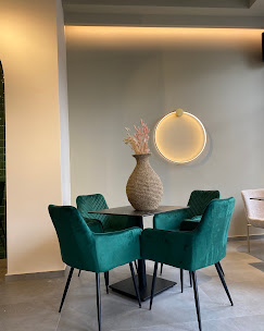 Corner table with teal velvet chairs
